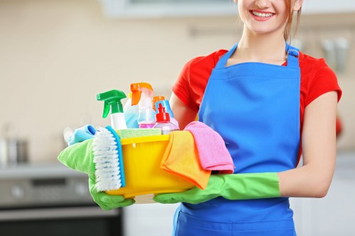 Worker loading household waste for a transparent Uxbridge clearance quote