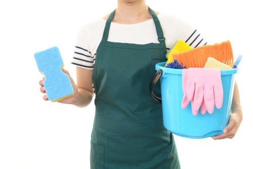 Cleaner wearing PPE while preparing a safe cleaning workspace