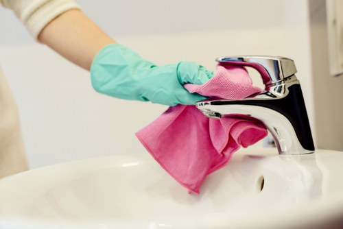 Cleaning staff following safe cleaning practices