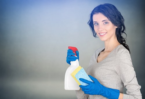 Local technician treating a stubborn stain on a sofa